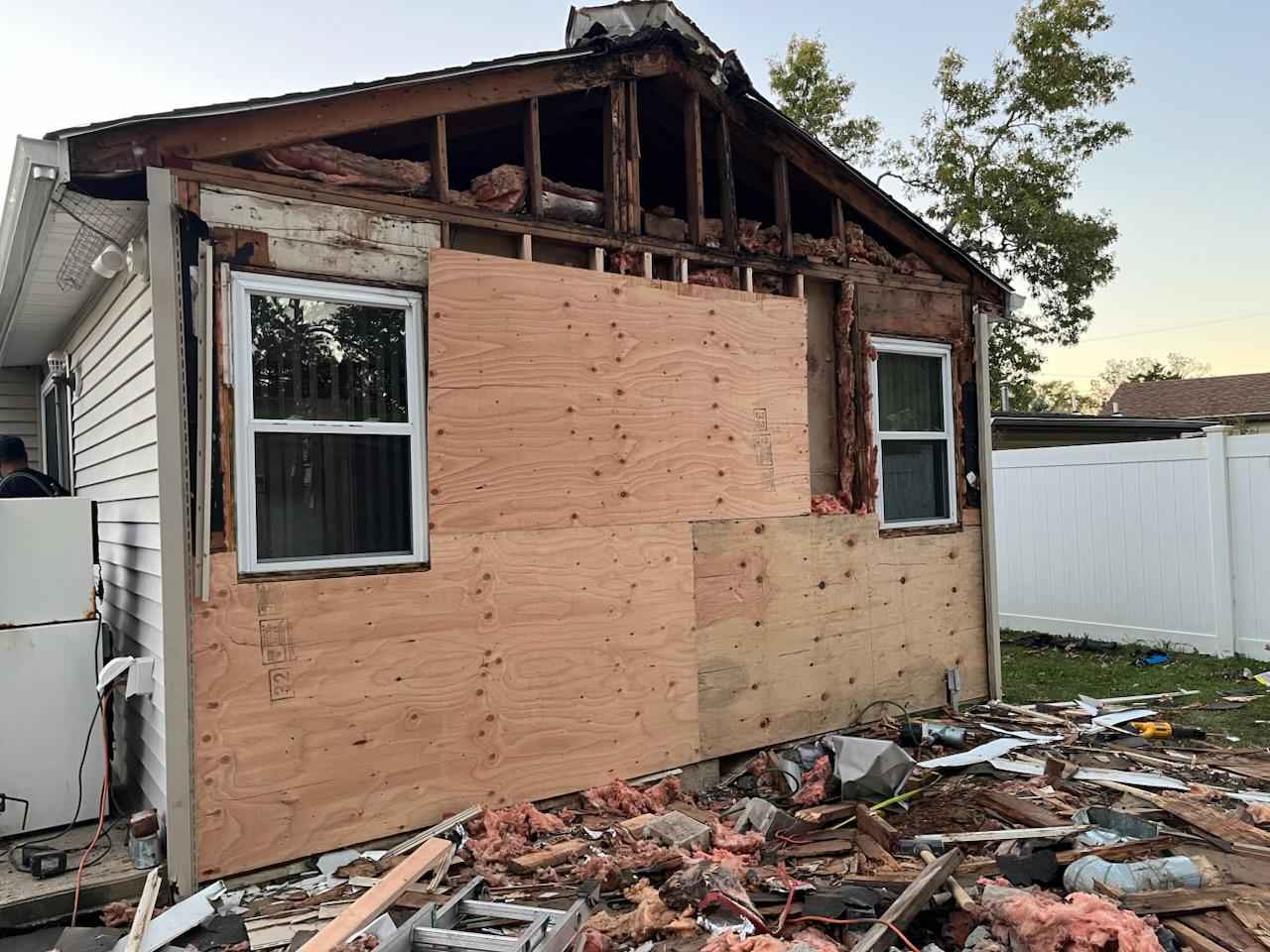 New plywood sheathing installed over the wall where the chimney used to be