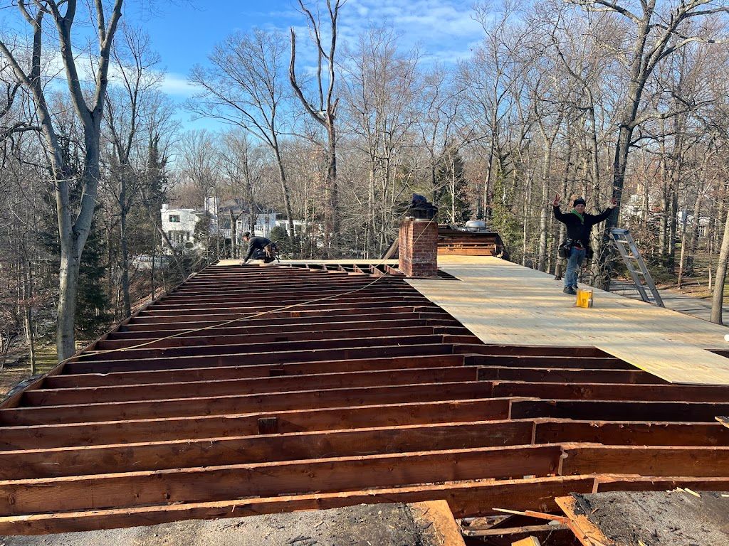 Flat roof section opened up to the joists for structural repair