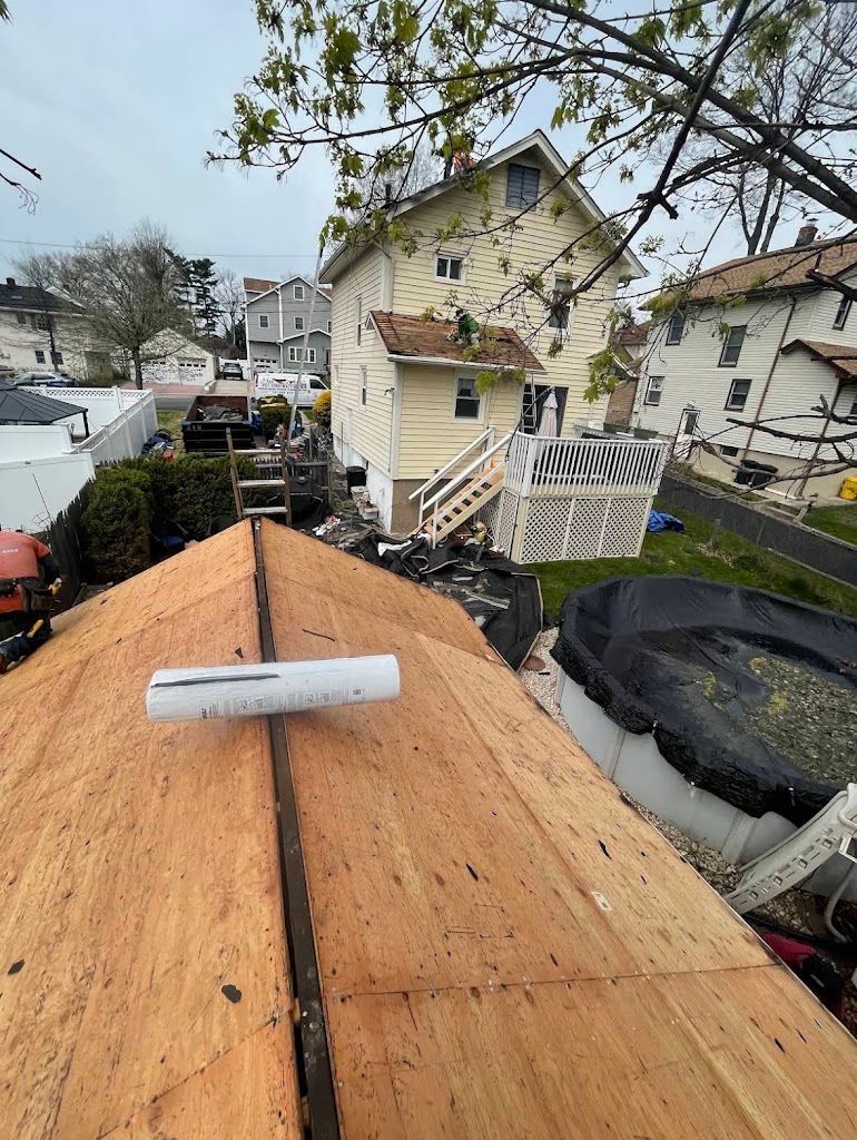 Fresh plywood roof deck with a plumbing vent pipe, ready for underlayment